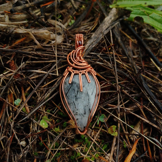 Tourmalinated quartz and ruby pendant